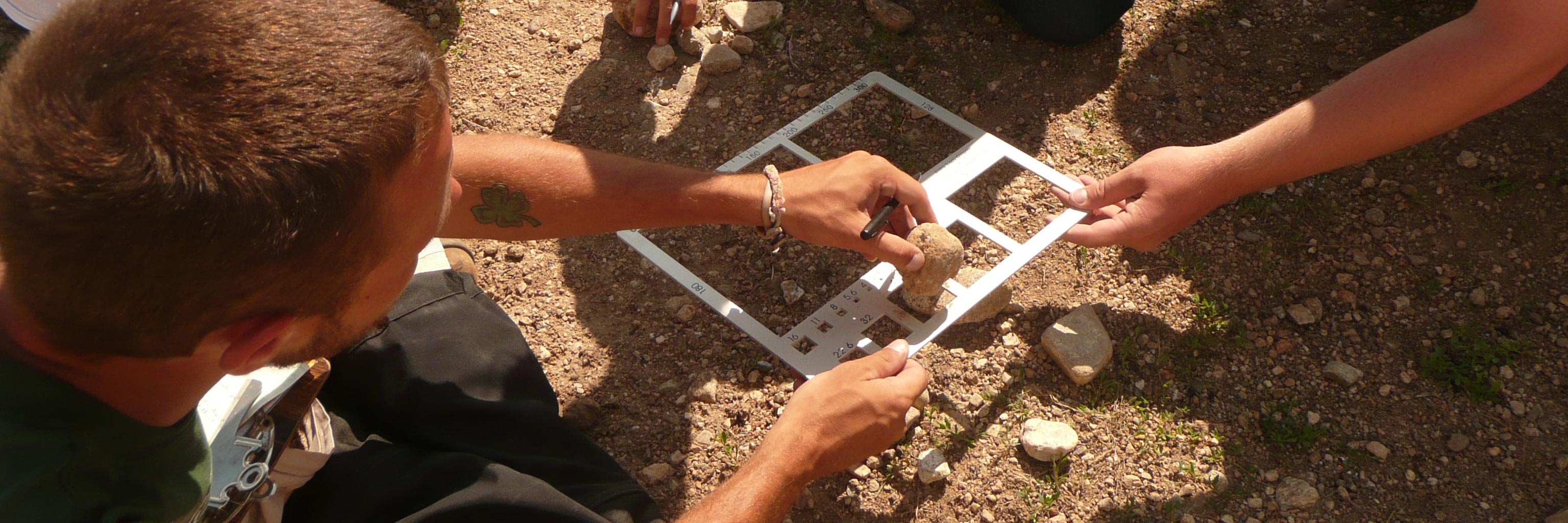 students measuring rocks